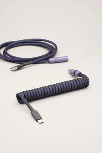 Coiled dark purple keyboard cable