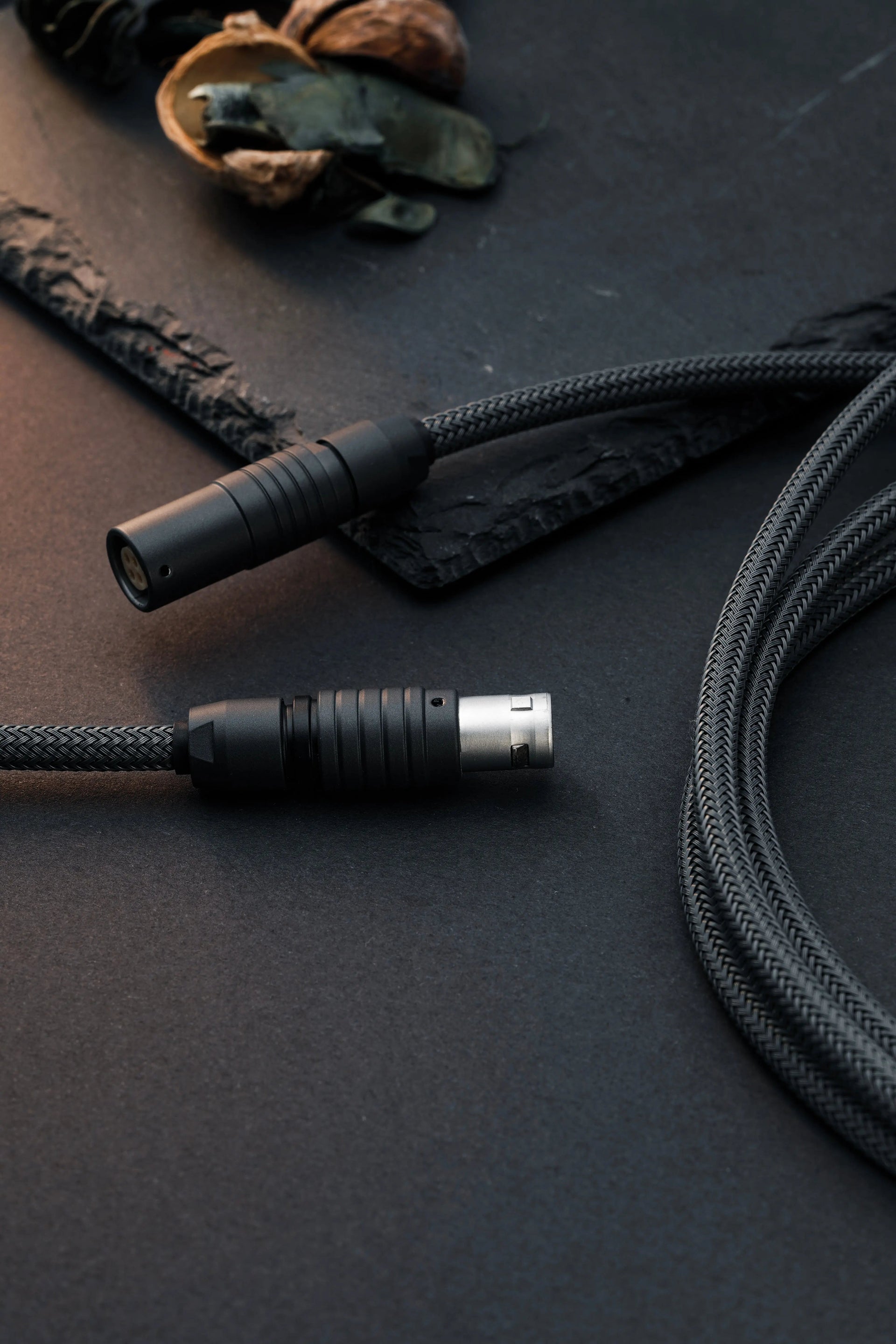 Dark grey coiled USB-C keyboard cable with push-pull cable 